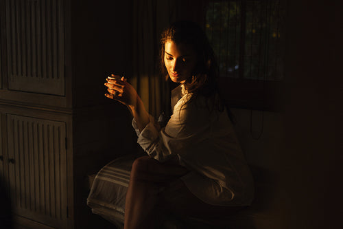 Female tourist relaxing in a luxury hotel room