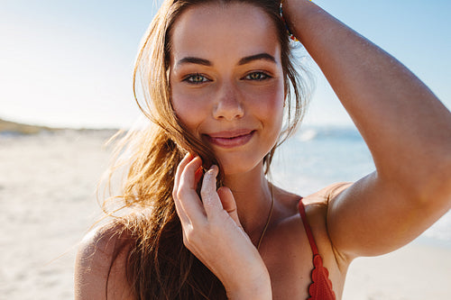 Sensual young woman posing on the beach