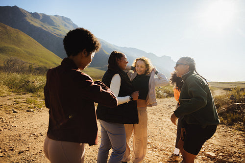 Friends gathering outdoors on a sunny day