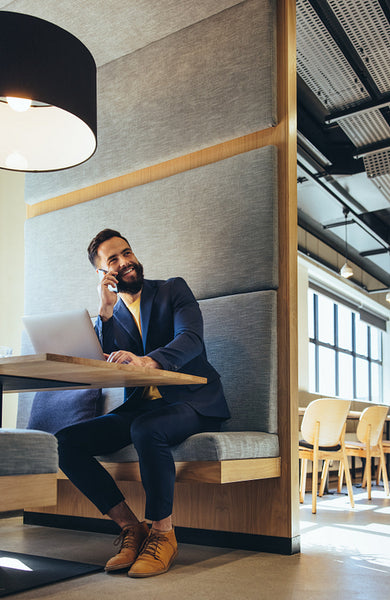 Young businessman speaking on a phone call