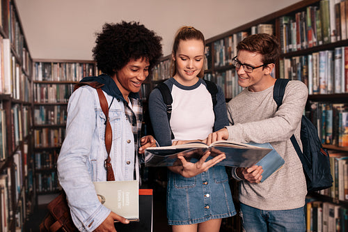 University students studying together in library