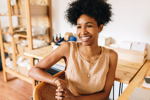 Happy jewelry designer in workshop