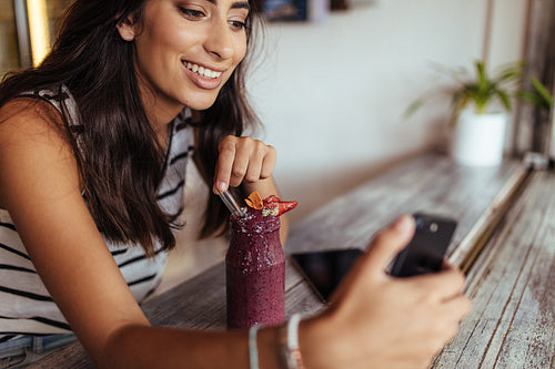 Woman taking a selfie for her blog