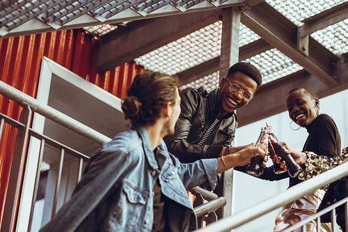 Multi-ethnic friends toasting soft drinks