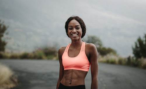 Young woman athlete on road