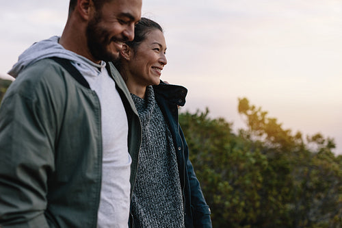 Smiling couple hiking in countryside