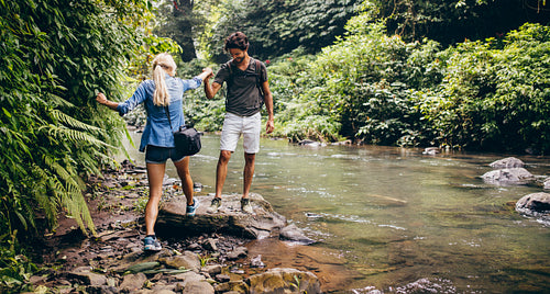 Young couple hiking in the forest