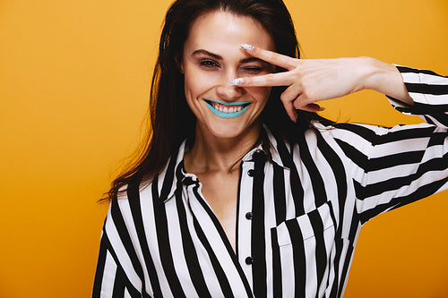 Smiling female model winking