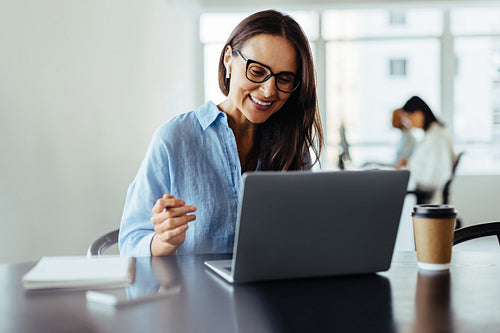Woman having an online business meeting in an office