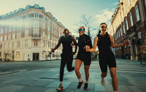 Community running unfolds on the city street with urban training and teamwork