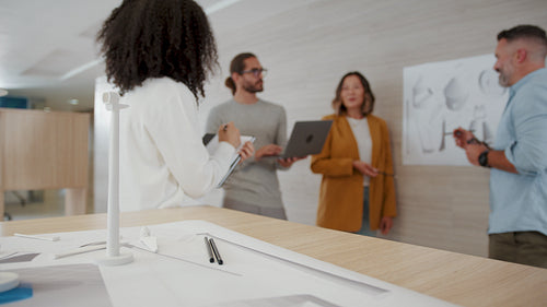 Creative professionals brainstorming ideas for an innovative design in a meeting