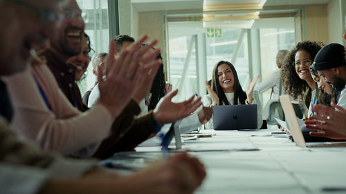 Happy business people applauding