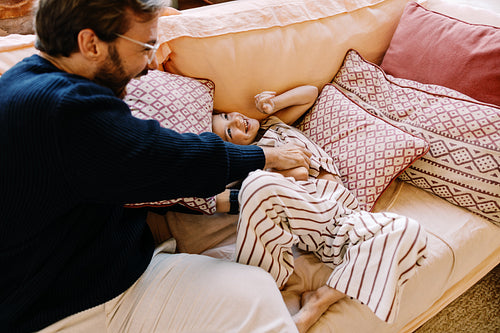 Family moment with dad and child on sofa