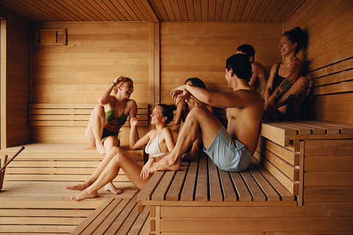 A smiling sauna session brings community, wellness, and spa relaxation together.