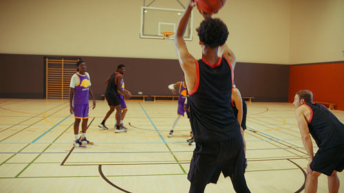 Basketball players celebrate victory