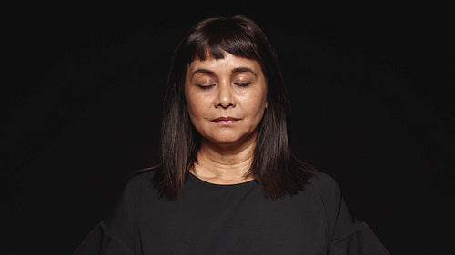 Woman with eyes closed