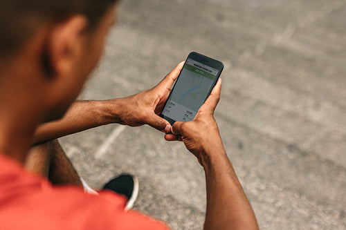 Monitoring his progress with a cool fitness app