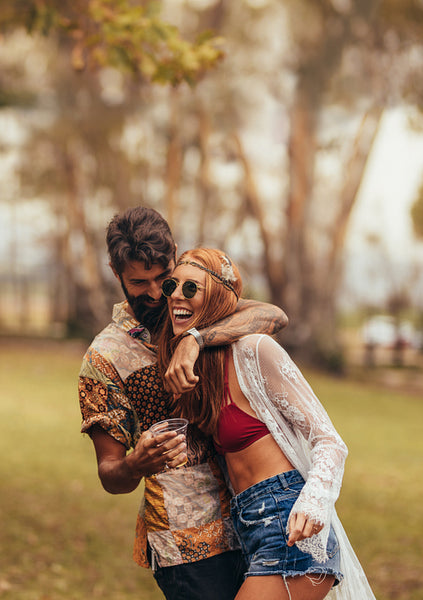 Hippie couple having fun at music festival