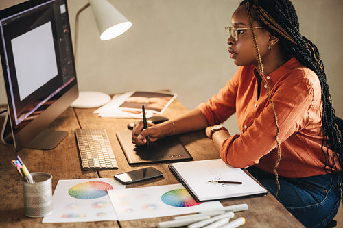 Female graphic designer working at her desk