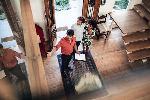 Estate agent presenting house to potential buyer