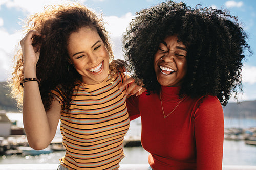 Female friends having fun on beach
