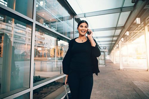 Travelling businesswoman making phone call