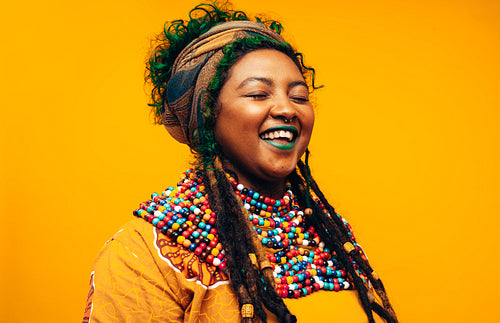 Carefree young woman wearing traditional clothing
