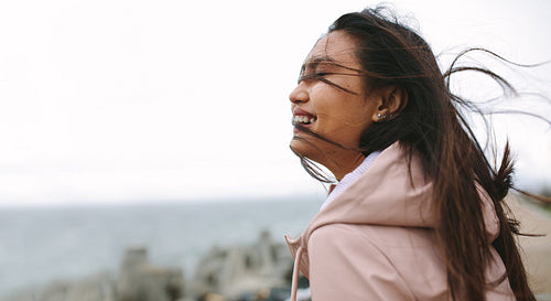 Smiling woman standing outdoors