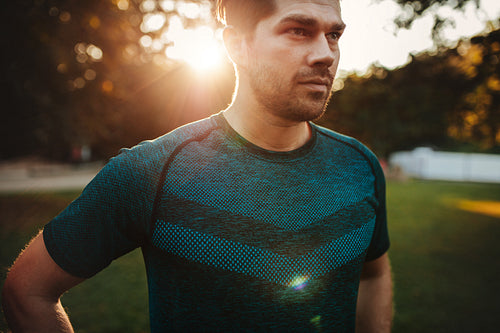 Fitness male model standing outdoors