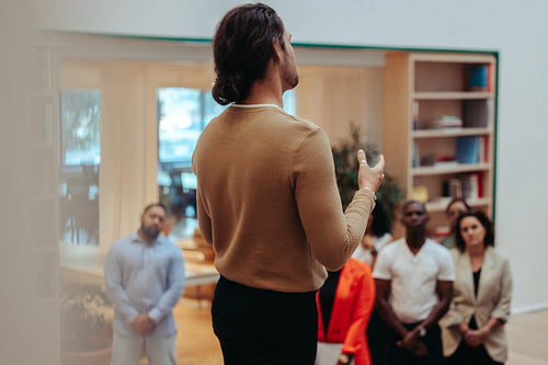 Professional teaches startup principles in informal meeting with attentive audience