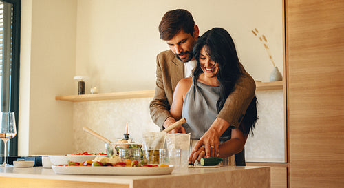 Couple preparing a meal together in a modern kitchen