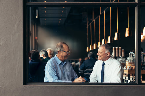 Business partners having a casual discussion at cafe