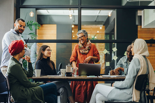 Cheerful businesspeople having a meeting in a boardroom