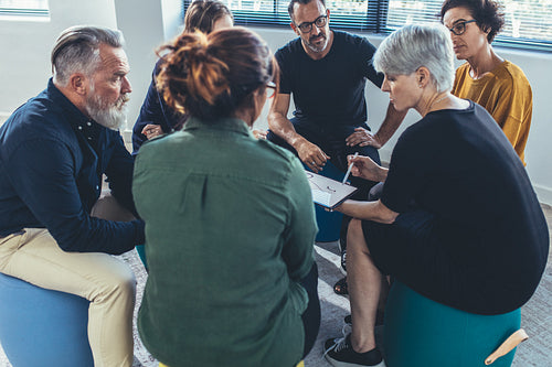 Office staff in a group discussion