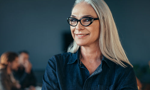 Smiling mature business woman in office