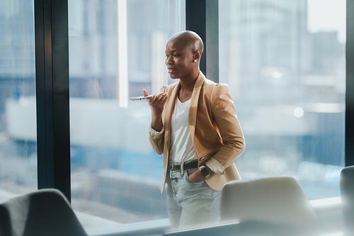 Mature businesswoman speaking on the phone in a corporate office