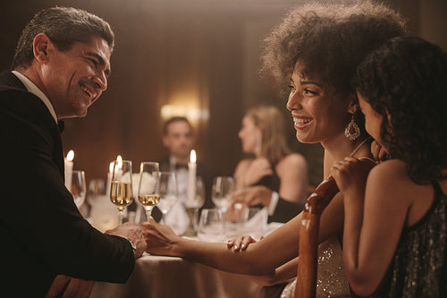 Family enjoying at new years eve dinner party