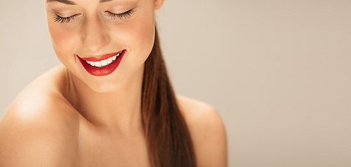 Shirtless young woman with makeup