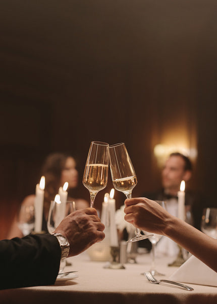 Couple celebrating with drinks at a party