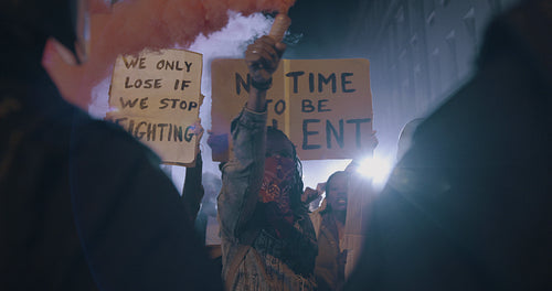 Protestors demonstrating with smoke bombs