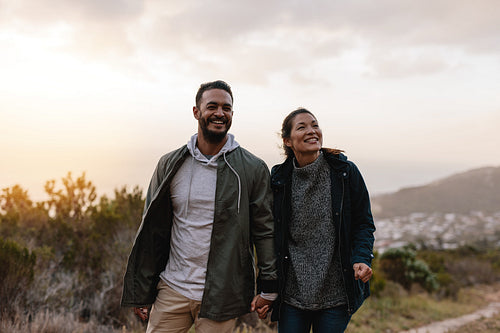 Happy hikers walking in the countryside