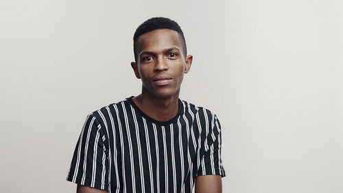  Smiling african male in striped tshirt