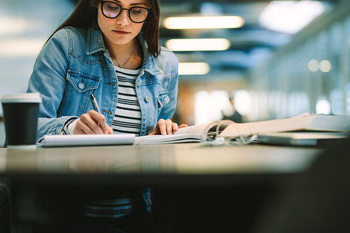 University student studying at college library