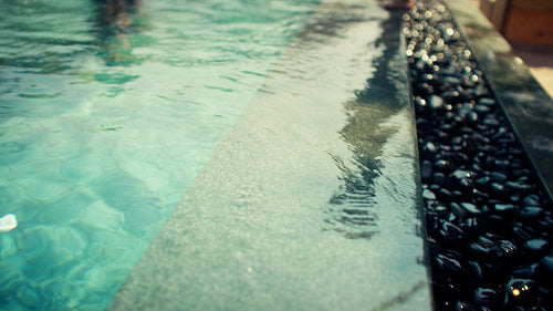 Happy father and son enjoy playful splashing and bonding in a luxurious resort pool