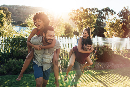 Happy couples having fun in the backyard