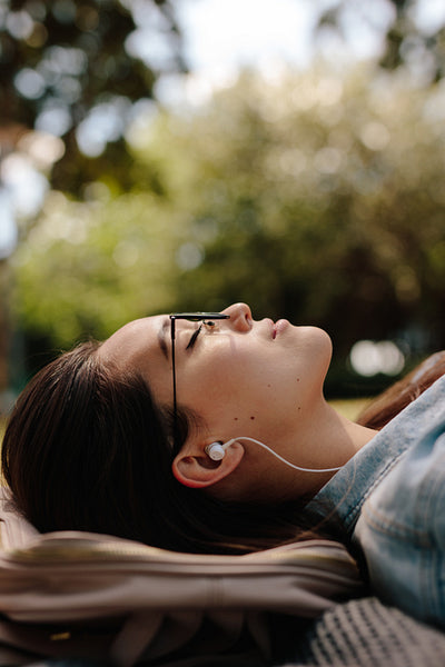 Close up of a woman sleeping outdoors