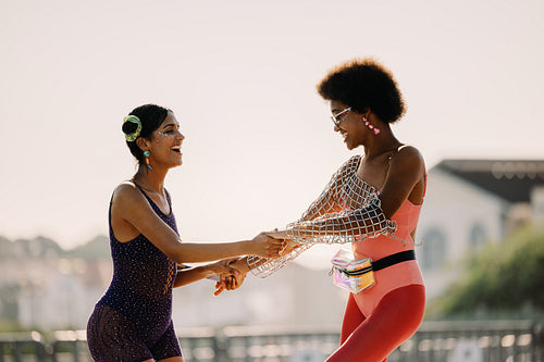 Two friends dancing at carnival