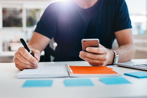 Young man hands working at his desk