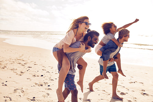 Young friends enjoying summertime on the beach