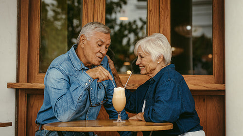Beautiful senior couple in love at cafe